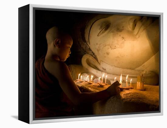 A Novice Monk Lighting Candles at a Massive Buddha Statue in Burma (Myanmar)-Kyle Hammons-Framed Premier Image Canvas