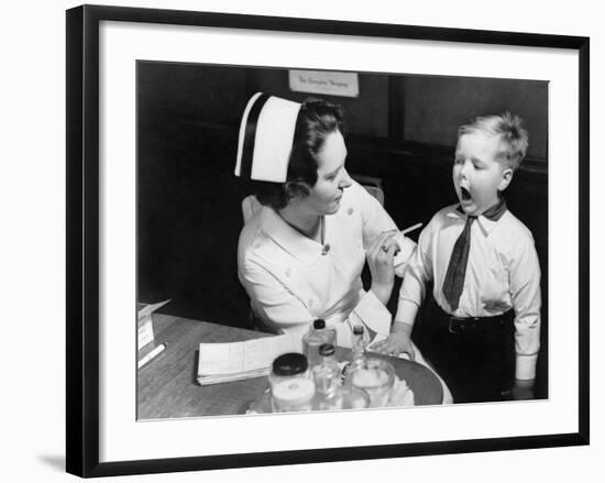 A Nurse Examining the Teeth of a Boy in New York, NY , Ca, 1935-null-Framed Photo