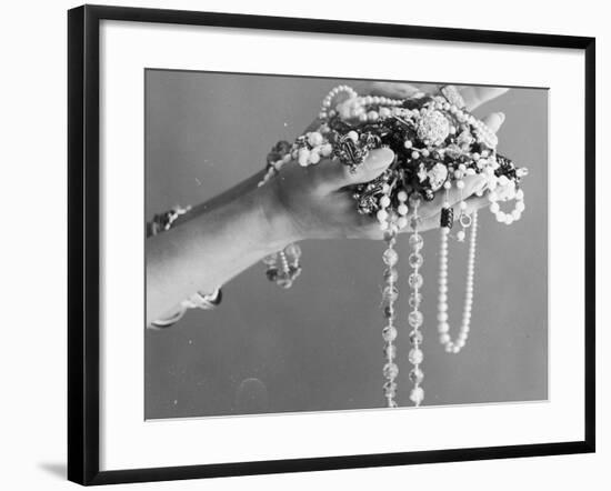 A Pair of Hands Holding All Sorts of Jewellery-null-Framed Photographic Print