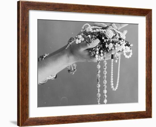 A Pair of Hands Holding All Sorts of Jewellery-null-Framed Photographic Print