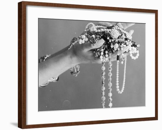 A Pair of Hands Holding All Sorts of Jewellery-null-Framed Photographic Print