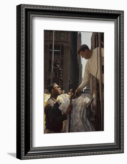 A Pair of Push Boys Unload Racks of Dresses on 7th Avenue, New York, New York, 1960-Walter Sanders-Framed Photographic Print