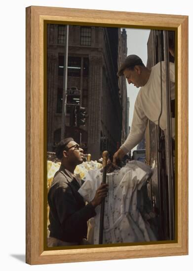 A Pair of Push Boys Unload Racks of Dresses on 7th Avenue, New York, New York, 1960-Walter Sanders-Framed Premier Image Canvas