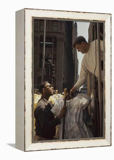 A Pair of Push Boys Unload Racks of Dresses on 7th Avenue, New York, New York, 1960-Walter Sanders-Framed Premier Image Canvas