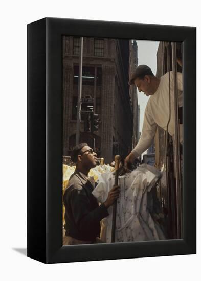 A Pair of Push Boys Unload Racks of Dresses on 7th Avenue, New York, New York, 1960-Walter Sanders-Framed Premier Image Canvas