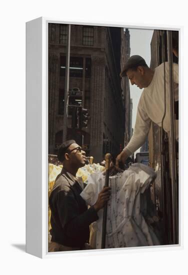 A Pair of Push Boys Unload Racks of Dresses on 7th Avenue, New York, New York, 1960-Walter Sanders-Framed Premier Image Canvas