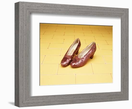 A Pair of Ruby Slippers Worn by Judy Garland in the 1939 MGM film "The Wizard of Oz"-null-Framed Premium Giclee Print