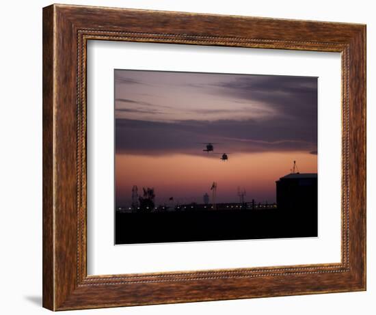 A Pair of UH-60 Black Hawk Helicopters Approach their Landing in Baghdad, Iraq-null-Framed Photographic Print