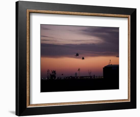 A Pair of UH-60 Black Hawk Helicopters Approach their Landing in Baghdad, Iraq-null-Framed Photographic Print