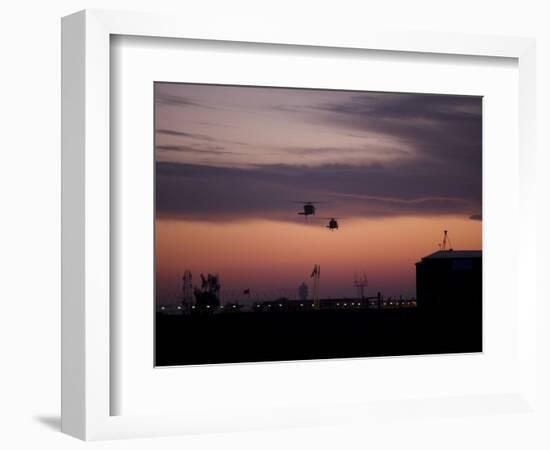 A Pair of UH-60 Black Hawk Helicopters Approach their Landing in Baghdad, Iraq-null-Framed Photographic Print
