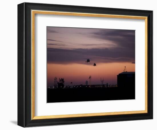 A Pair of UH-60 Black Hawk Helicopters Approach their Landing in Baghdad, Iraq-null-Framed Photographic Print