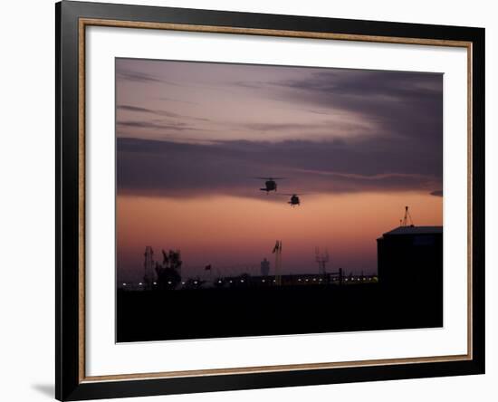 A Pair of UH-60 Black Hawk Helicopters Approach their Landing in Baghdad, Iraq-null-Framed Photographic Print