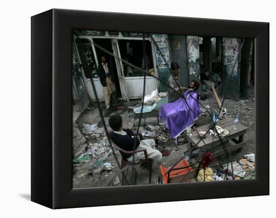 A Pakistani Barber Gives a Haircut and Beard Trim to a Customer-null-Framed Premier Image Canvas