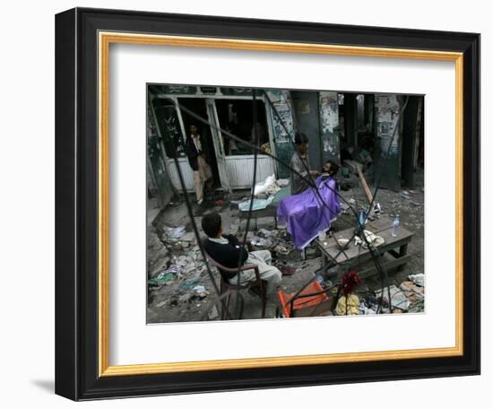 A Pakistani Barber Gives a Haircut and Beard Trim to a Customer-null-Framed Photographic Print