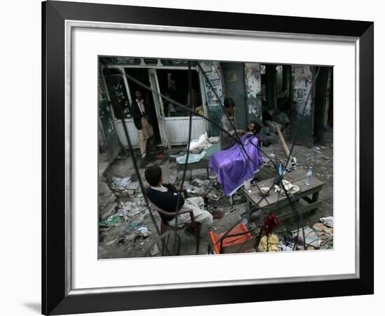 A Pakistani Barber Gives a Haircut and Beard Trim to a Customer-null-Framed Photographic Print