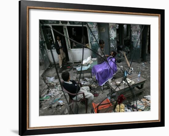 A Pakistani Barber Gives a Haircut and Beard Trim to a Customer-null-Framed Photographic Print