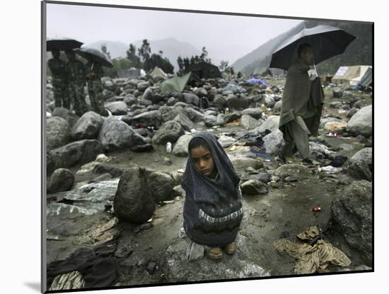 A Pakistani Earthquake Survivor Shivers-null-Mounted Photographic Print