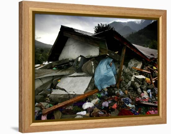 A Pakistani Earthquake Survivor Takes Shelter from the Rain-null-Framed Premier Image Canvas