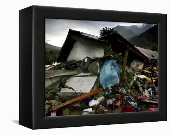 A Pakistani Earthquake Survivor Takes Shelter from the Rain-null-Framed Premier Image Canvas