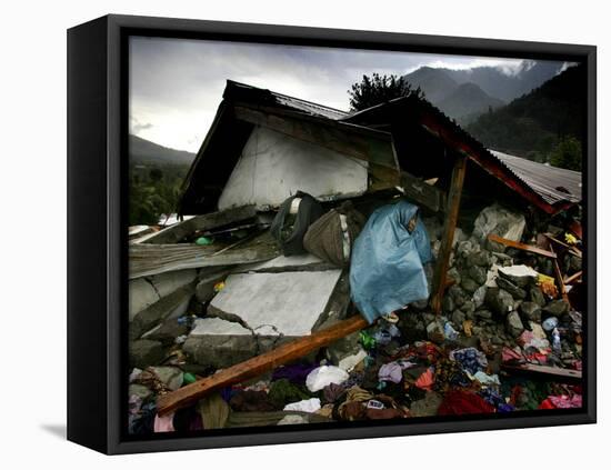 A Pakistani Earthquake Survivor Takes Shelter from the Rain-null-Framed Premier Image Canvas