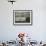 A Palestinian Sits Near the Stand of a Street Seller Displaying Goods for Sale-null-Framed Photographic Print displayed on a wall