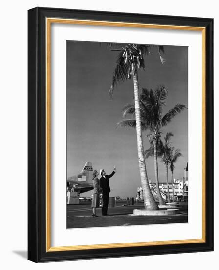 A Pan American Pilot and Flight Attendant the Edge of the Tarmac at Miami International Airport-null-Framed Photographic Print