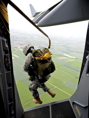A Paratrooper Executes An Airborne Jump Out of a C-17 Globemaster III'  Photographic Print - Stocktrek Images