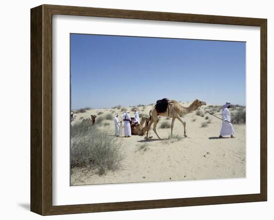 A party of Bedouin leading their camels in the desert-Werner Forman-Framed Giclee Print