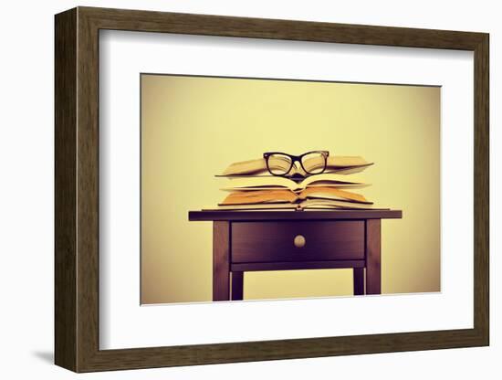 A Pile of Books and a Pair of Eyeglasses on a Desk, Symbolizing the Concept of Reading Habit or Stu-nito-Framed Photographic Print