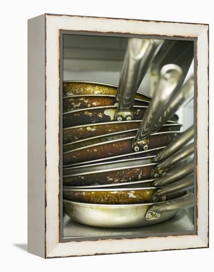 A Pile of Frying Pans in a Commercial Kitchen-Herbert Lehmann-Framed Premier Image Canvas