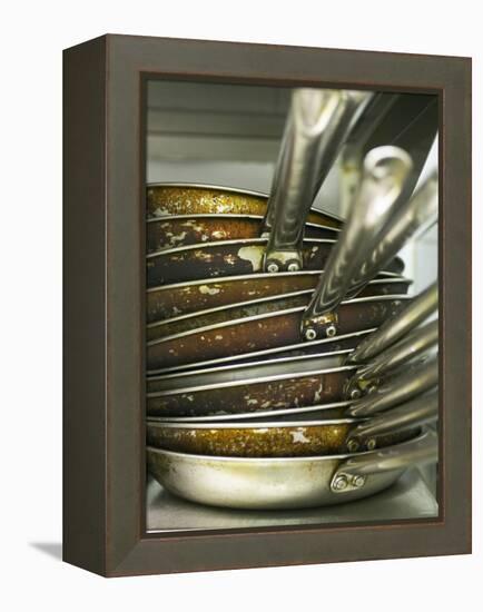 A Pile of Frying Pans in a Commercial Kitchen-Herbert Lehmann-Framed Premier Image Canvas