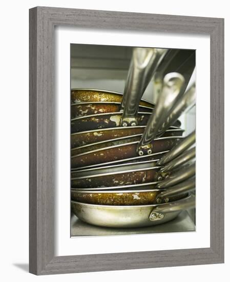 A Pile of Frying Pans in a Commercial Kitchen-Herbert Lehmann-Framed Photographic Print