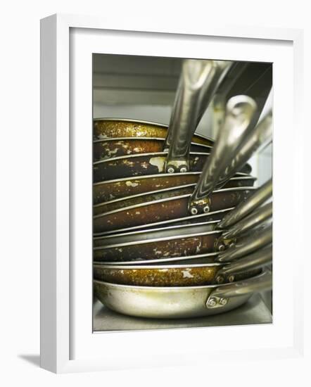 A Pile of Frying Pans in a Commercial Kitchen-Herbert Lehmann-Framed Photographic Print