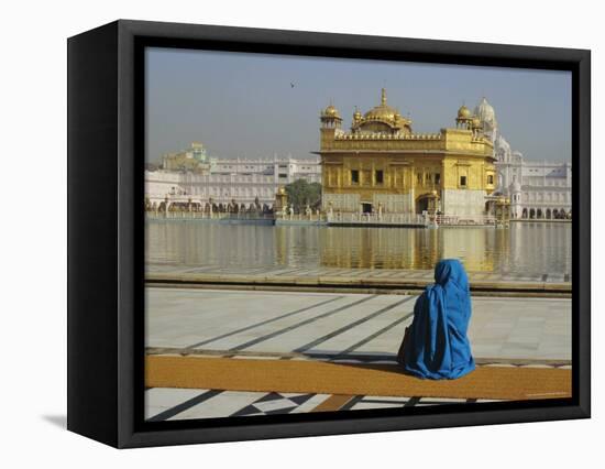 A Pilgrim in Blue Sits by the Holy Pool of Nectar at the Golden Temple, Punjab, India-Jeremy Bright-Framed Premier Image Canvas