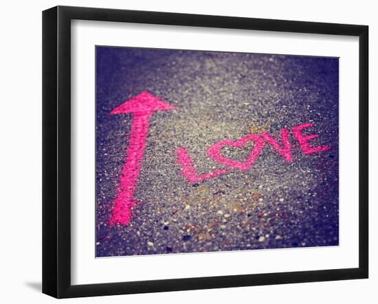 A Pink Arrow Showing the Way to Love Written on a Sidewalk with Chalk Toned with a Retro Vintage In-graphicphoto-Framed Photographic Print