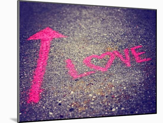 A Pink Arrow Showing the Way to Love Written on a Sidewalk with Chalk Toned with a Retro Vintage In-graphicphoto-Mounted Photographic Print