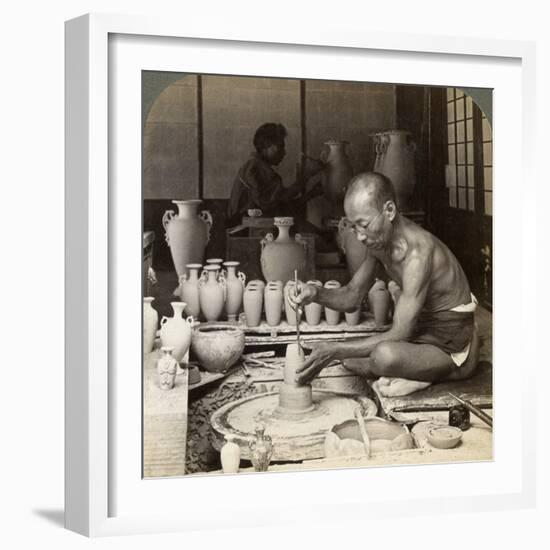 A Potter and His Wheel, Fashioning a Vase of Awata Porcelain, Kinkosan Works, Kyoto, Japan, 1904-Underwood & Underwood-Framed Photographic Print