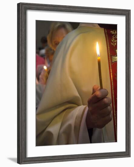 A Priest's Hand Holding a Candle During Mass in Easter Week, Old City, Israel-Eitan Simanor-Framed Photographic Print