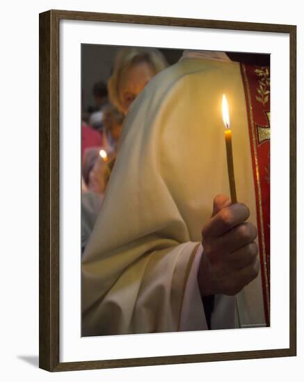 A Priest's Hand Holding a Candle During Mass in Easter Week, Old City, Israel-Eitan Simanor-Framed Photographic Print