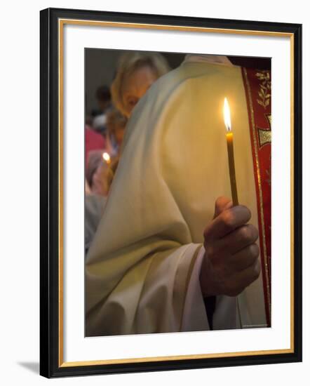 A Priest's Hand Holding a Candle During Mass in Easter Week, Old City, Israel-Eitan Simanor-Framed Photographic Print