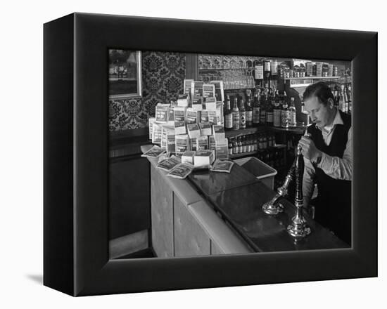 A Pub Landlord with a Display of the Batchelors 5 Day Catering Pack on His Bar, 1968-Michael Walters-Framed Premier Image Canvas