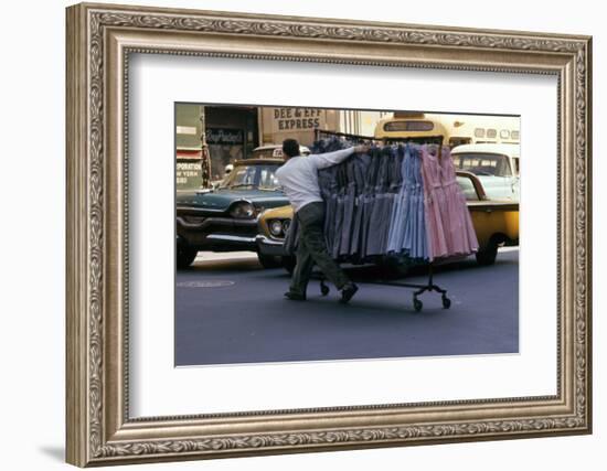 A Push Boy Steers a Rack of Dresses across an Intersection, New York, New York, 1960-Walter Sanders-Framed Photographic Print