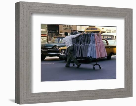 A Push Boy Steers a Rack of Dresses across an Intersection, New York, New York, 1960-Walter Sanders-Framed Photographic Print