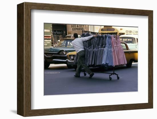 A Push Boy Steers a Rack of Dresses across an Intersection, New York, New York, 1960-Walter Sanders-Framed Photographic Print