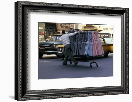 A Push Boy Steers a Rack of Dresses across an Intersection, New York, New York, 1960-Walter Sanders-Framed Photographic Print