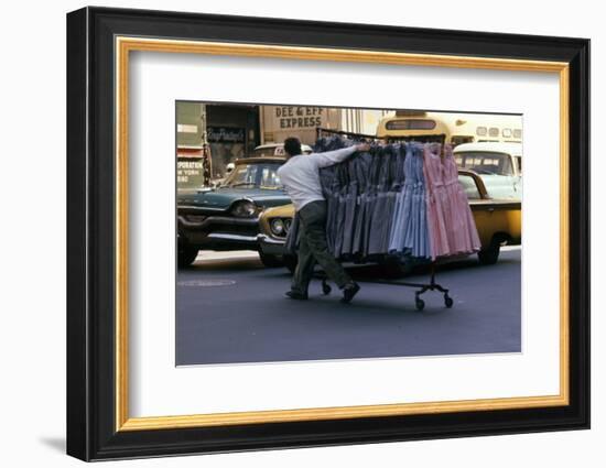A Push Boy Steers a Rack of Dresses across an Intersection, New York, New York, 1960-Walter Sanders-Framed Photographic Print