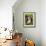 A Rabbit Sits in a Basket on a Blooming Meadow around Easter Time-null-Framed Photo displayed on a wall