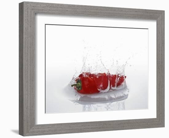 A Red Chilli Pepper Falling into Water-Kröger & Gross-Framed Photographic Print