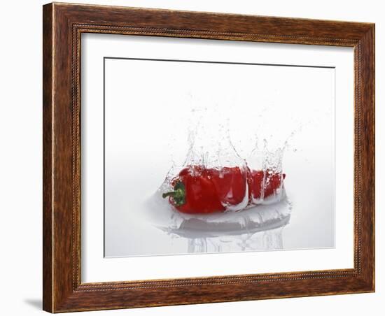 A Red Chilli Pepper Falling into Water-Kröger & Gross-Framed Photographic Print