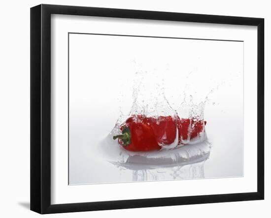 A Red Chilli Pepper Falling into Water-Kröger & Gross-Framed Photographic Print